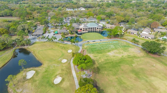 bird's eye view with golf course view, a water view, and a residential view