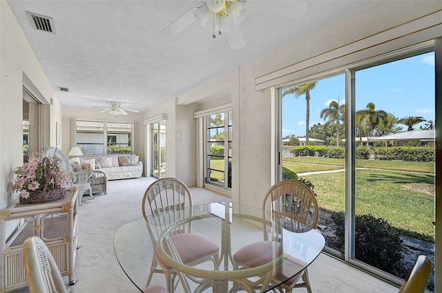 sunroom with carpet floors and visible vents