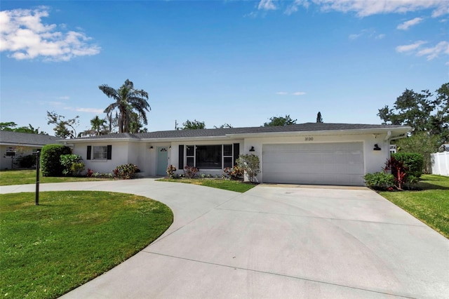 single story home with fence, an attached garage, stucco siding, a front yard, and curved driveway