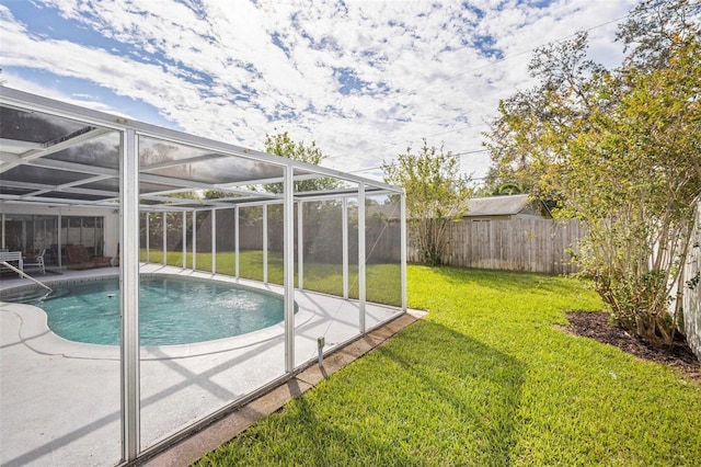 view of swimming pool featuring a fenced backyard, a fenced in pool, a patio area, a lawn, and a lanai