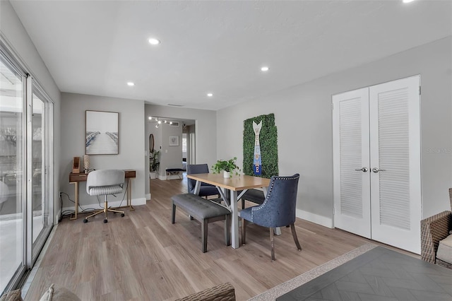 dining area featuring recessed lighting, baseboards, and light wood-style floors
