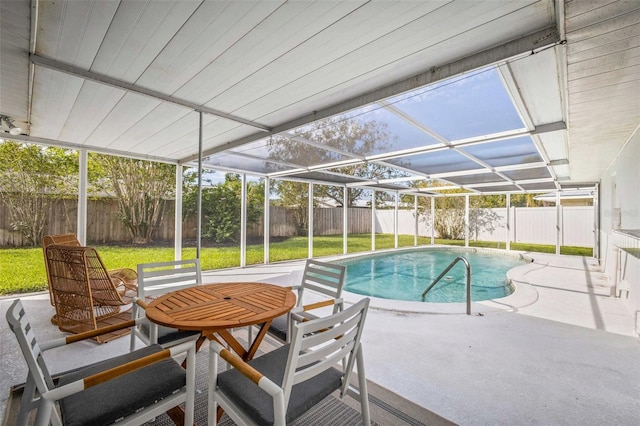 view of swimming pool featuring a fenced backyard, a fenced in pool, a lawn, and a patio area