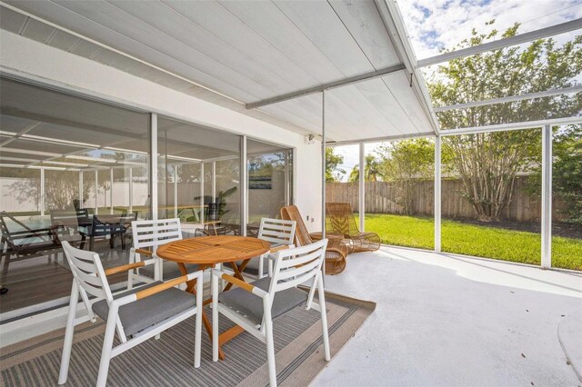 sunroom with outdoor dining area