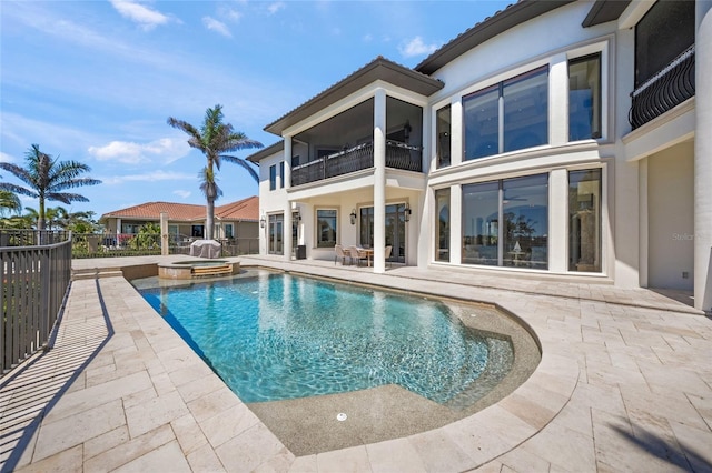 5830 Jamila River Dr, Venice, FL 34293 - view of swimming pool featuring a pool with connected hot tub, a patio, and fence