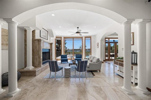 5830 Jamila River Dr, Venice, FL 34293 - living room with recessed lighting, a high end fireplace, a ceiling fan, and ornate columns