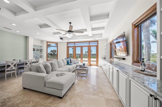 5830 Jamila River Dr, Venice, FL 34293 - living area featuring coffered ceiling, visible vents, a ceiling fan, french doors, and beam ceiling