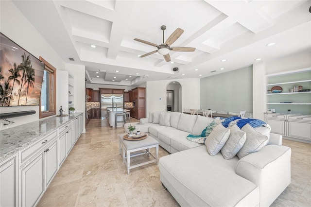5830 Jamila River Dr, Venice, FL 34293 - living area featuring recessed lighting, coffered ceiling, visible vents, arched walkways, and ceiling fan