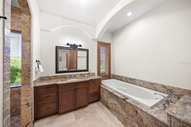 5830 Jamila River Dr, Venice, FL 34293 - bathroom featuring recessed lighting, a bath, and vanity