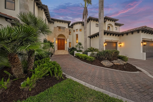 5830 Jamila River Dr, Venice, FL 34293 - mediterranean / spanish-style home with a tiled roof, stucco siding, and decorative driveway