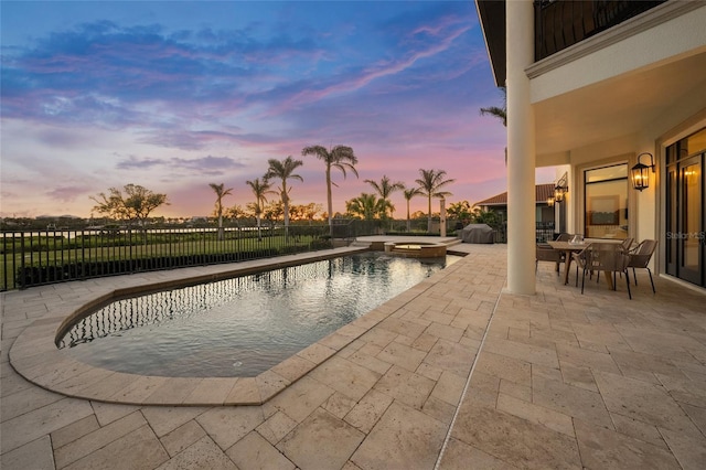 5830 Jamila River Dr, Venice, FL 34293 - view of swimming pool featuring a patio area, a pool with connected hot tub, outdoor dining space, and a fenced backyard