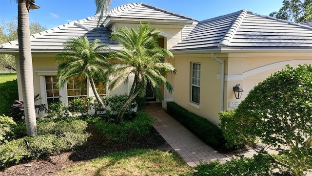 7528 Ascot Ct, Bradenton, FL 34201 - view of side of home with stucco siding and a garage