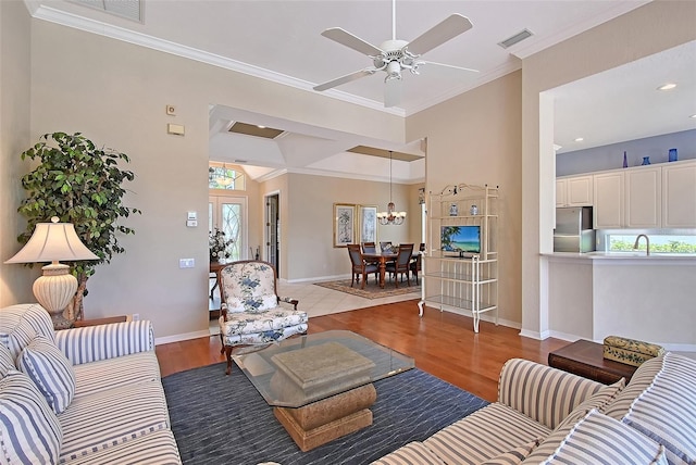 7528 Ascot Ct, Bradenton, FL 34201 - living room featuring plenty of natural light, crown molding, a ceiling fan, wood finished floors, and baseboards