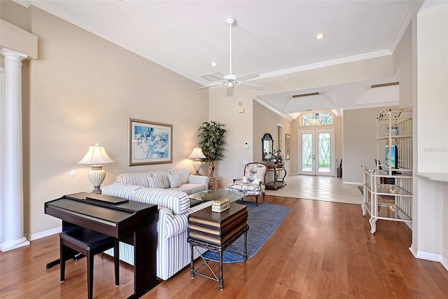 7528 Ascot Ct, Bradenton, FL 34201 - living area featuring ornate columns, ornamental molding, wood finished floors, french doors, and baseboards