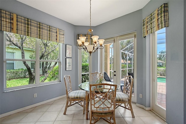 7528 Ascot Ct, Bradenton, FL 34201 - dining area with a chandelier, baseboards, and light tile patterned floors