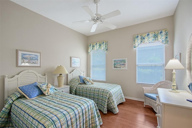 7528 Ascot Ct, Bradenton, FL 34201 - bedroom with wood finished floors, baseboards, and a ceiling fan