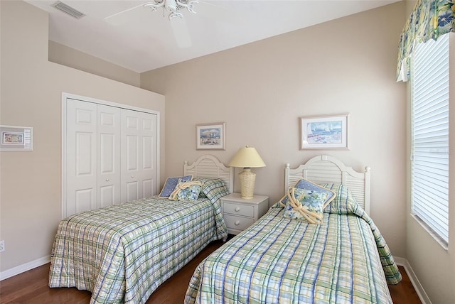 7528 Ascot Ct, Bradenton, FL 34201 - bedroom with baseboards, a closet, wood finished floors, and a ceiling fan