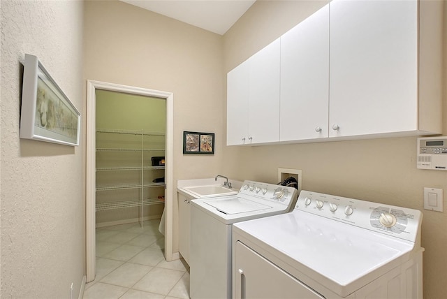7528 Ascot Ct, Bradenton, FL 34201 - laundry room with cabinet space, separate washer and dryer, and light tile patterned flooring