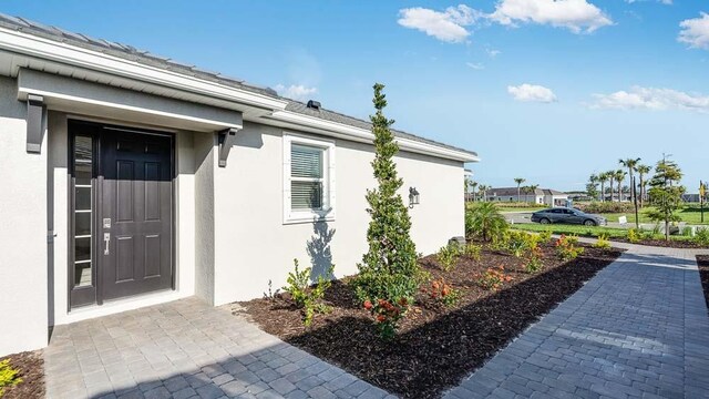 16202 Isola Pl, Bradenton, FL 34211 - property entrance with stucco siding