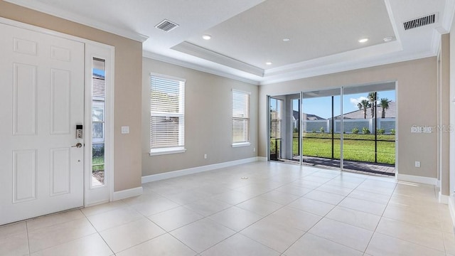 16202 Isola Pl, Bradenton, FL 34211 - spare room with a raised ceiling, healthy amount of natural light, baseboards, ornamental molding, and recessed lighting