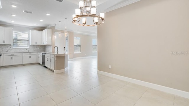 16202 Isola Pl, Bradenton, FL 34211 - kitchen with crown molding, stainless steel dishwasher, a peninsula, a chandelier, and decorative backsplash