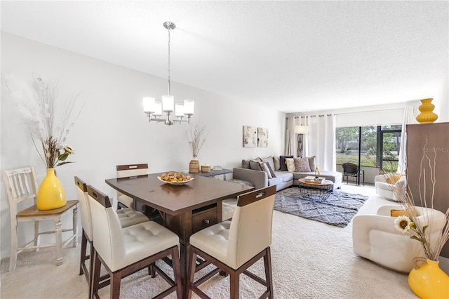 dining area with a notable chandelier and light colored carpet
