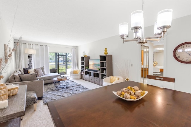 dining space with a notable chandelier