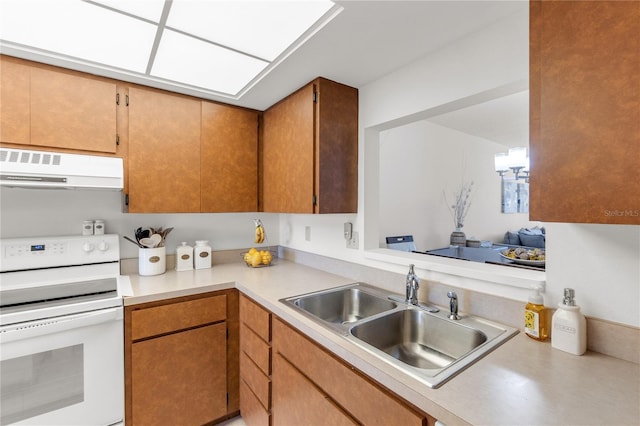 kitchen featuring white electric range oven, light countertops, exhaust hood, and a sink