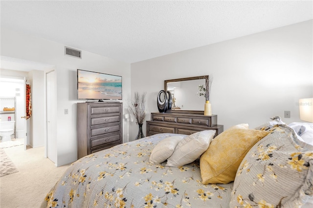 bedroom featuring carpet flooring and visible vents
