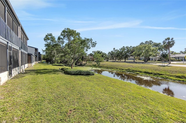 view of yard with a water view