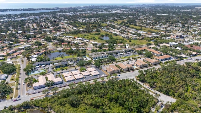 birds eye view of property with a residential view and a water view