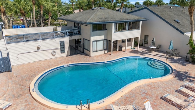 community pool featuring a patio area