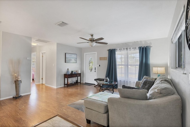 4243 Maceachen Blvd, Sarasota, FL 34233 - living room with light wood-style floors, visible vents, baseboards, and ceiling fan