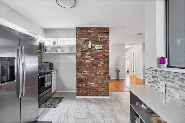 4243 Maceachen Blvd, Sarasota, FL 34233 - kitchen featuring visible vents, white cabinets, open shelves, light countertops, and appliances with stainless steel finishes