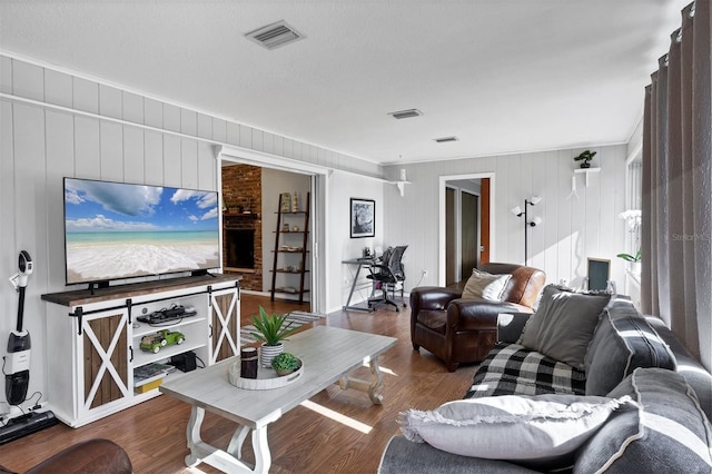 4243 Maceachen Blvd, Sarasota, FL 34233 - living room featuring visible vents and wood finished floors