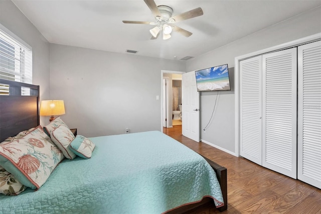 4243 Maceachen Blvd, Sarasota, FL 34233 - bedroom featuring visible vents, baseboards, a closet, a ceiling fan, and wood finished floors