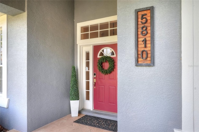 5810 Lake Victoria Dr, Lakeland, FL 33813 - property entrance with stucco siding