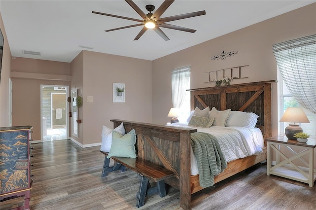 5810 Lake Victoria Dr, Lakeland, FL 33813 - bedroom featuring wood finished floors, ceiling fan, baseboards, and visible vents