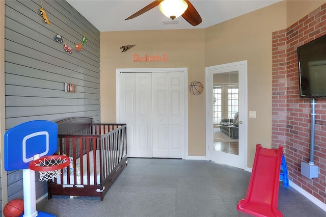 5810 Lake Victoria Dr, Lakeland, FL 33813 - bedroom with wooden walls, a closet, ceiling fan, and baseboards