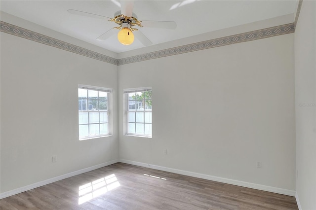 5810 Lake Victoria Dr, Lakeland, FL 33813 - empty room with baseboards, a ceiling fan, and wood finished floors