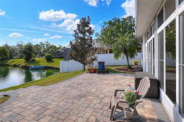 5810 Lake Victoria Dr, Lakeland, FL 33813 - view of patio featuring a water view and fence