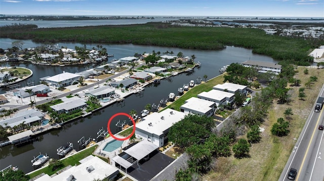 aerial view of residential area with a nearby body of water
