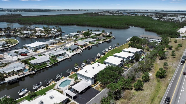 aerial perspective of suburban area featuring a large body of water