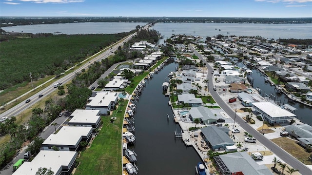 aerial overview of property's location featuring a large body of water and nearby suburban area