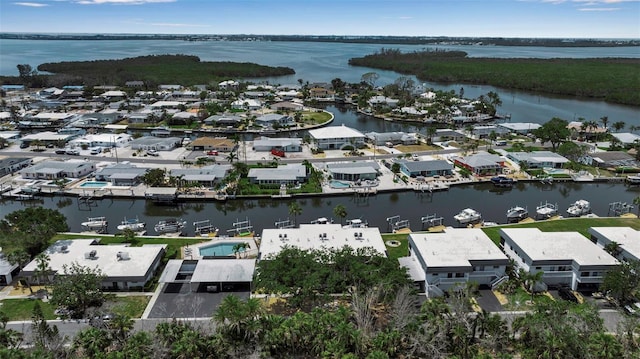 aerial perspective of suburban area featuring a large body of water