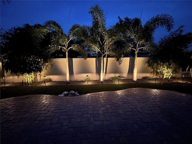 1719 Kenilworth St, Sarasota, FL 34231 - patio at twilight featuring a patio area and a fenced backyard