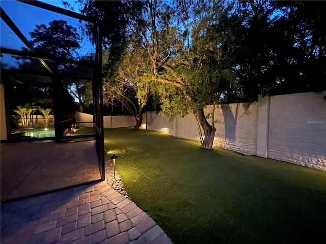 1719 Kenilworth St, Sarasota, FL 34231 - fenced backyard with a patio and glass enclosure