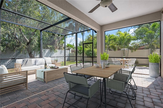 1719 Kenilworth St, Sarasota, FL 34231 - sunroom with outdoor dining space, a ceiling fan, and an outdoor hangout area