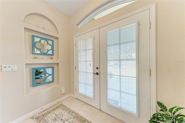 1631 Madison Ave, North Port, FL 34286 - doorway featuring plenty of natural light, light tile patterned floors, and french doors