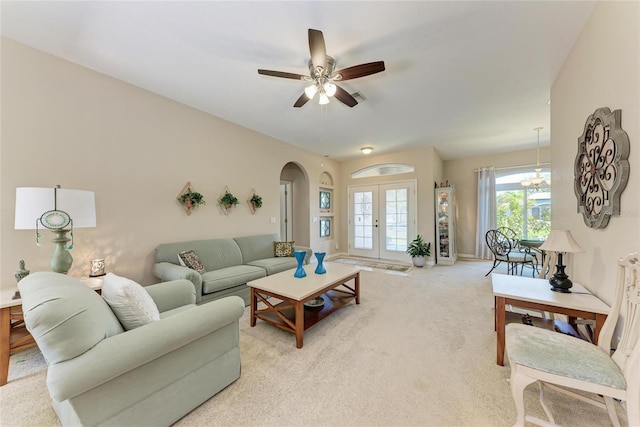 1631 Madison Ave, North Port, FL 34286 - living area featuring arched walkways, light colored carpet, and ceiling fan