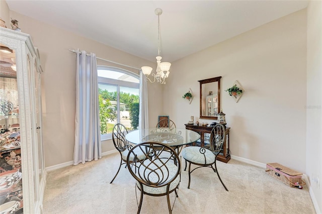 1631 Madison Ave, North Port, FL 34286 - dining room with a chandelier, light colored carpet, and baseboards